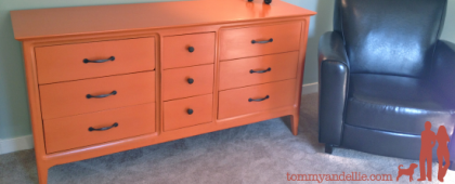 Repainted old dresser Orange for a boy's nursery. www.tommyandellie.com