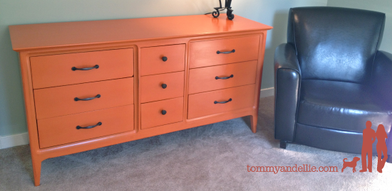 Repainted old dresser Orange for a boy's nursery. www.tommyandellie.com